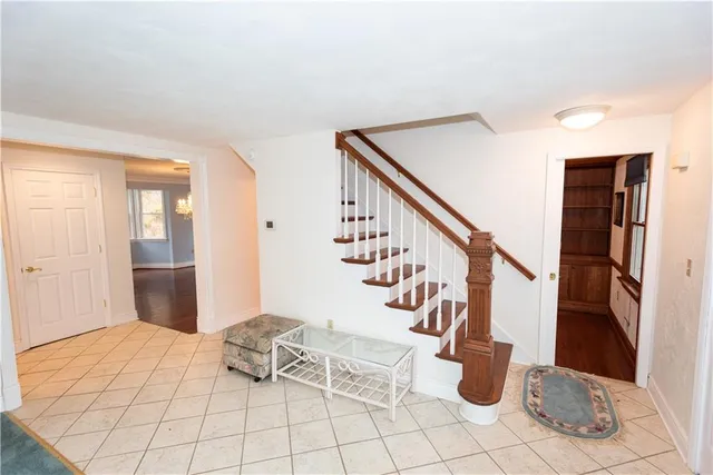 a view of entryway with furniture and rug