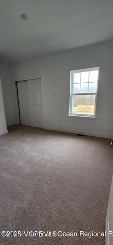 a bathroom with a shower and a toilet