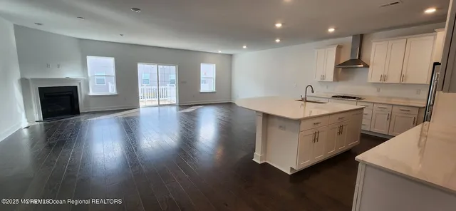 a kitchen with a sink and a stove top oven