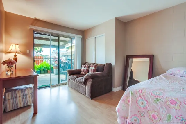 a bed room with a bed and a window