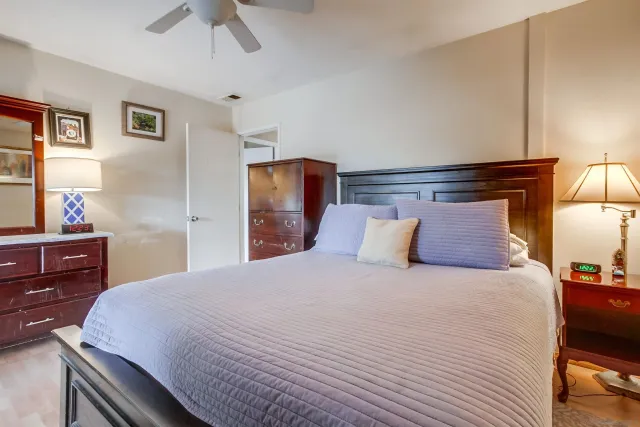 a bedroom with a bed and a dresser