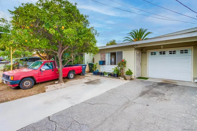 a view of car parked in front of house