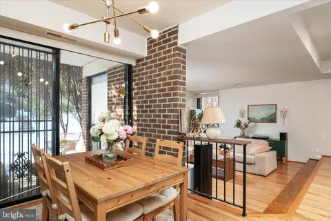 a view of a dining room with furniture and window