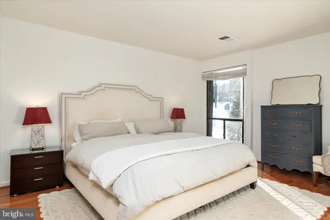 a bedroom with a bed and a closet