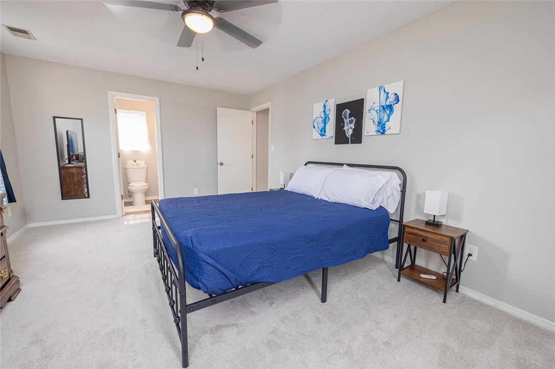 410 South Cove Road Seneca, SC 29672 - Photo 23 of 25 This restful bedroom features soft carpeting and convenient access to a private bathroom.