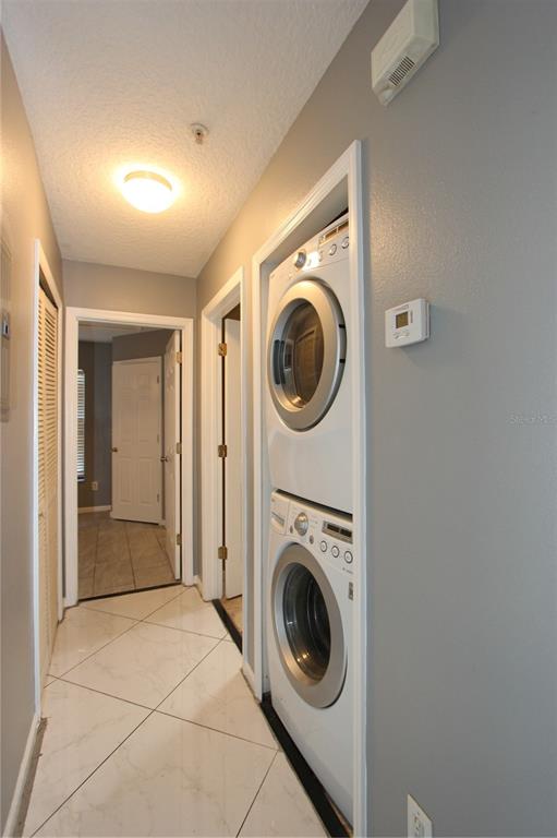 1131 South Pine Ridge Circle, Unit 1 Sanford, FL 32773 - Photo 11 of 19 a view of a hallway with washer and dryer