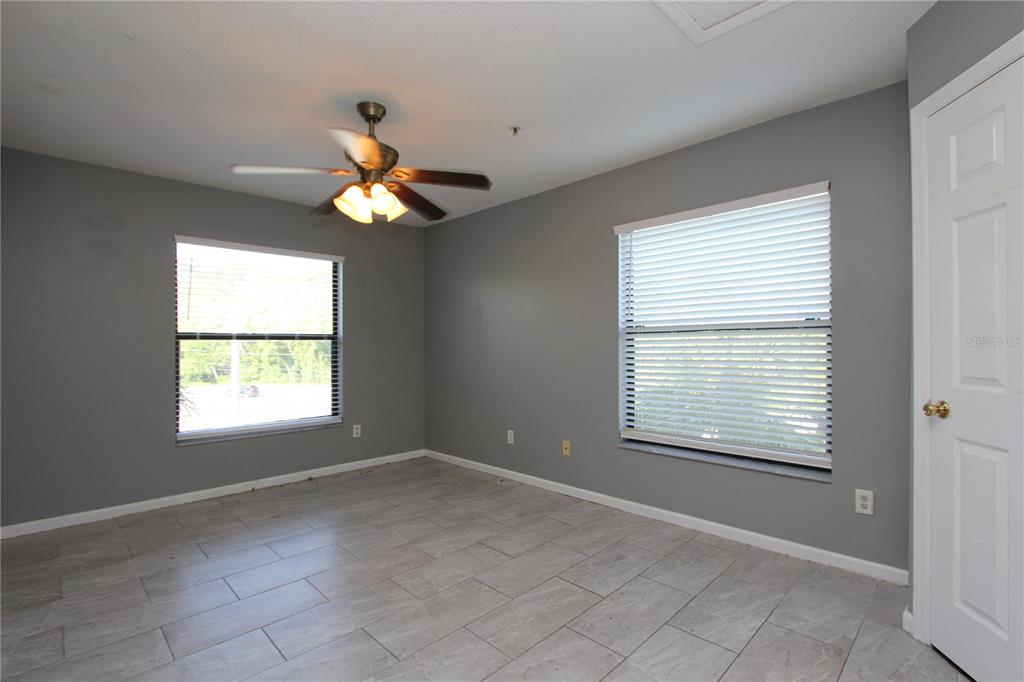 1131 South Pine Ridge Circle, Unit 1 Sanford, FL 32773 - Photo 12 of 19 a view of an empty room with a window