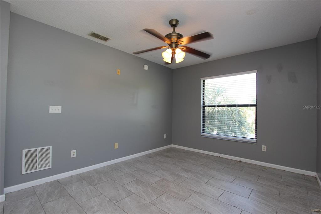 1131 South Pine Ridge Circle, Unit 1 Sanford, FL 32773 - Photo 13 of 19 a view of an empty room with a window