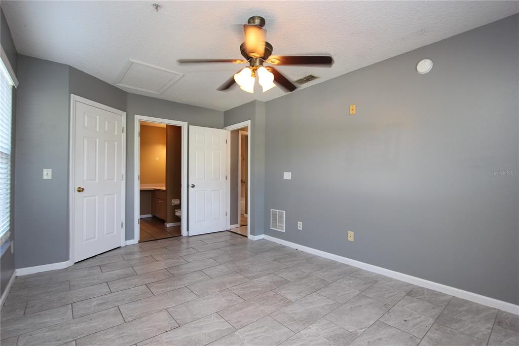 1131 South Pine Ridge Circle, Unit 1 Sanford, FL 32773 - Photo 14 of 19 a view of an empty room and window