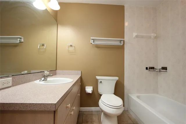 a bathroom with a sink toilet and a bathtub