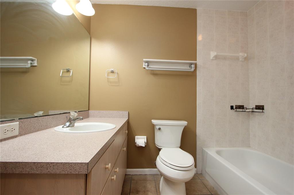 1131 South Pine Ridge Circle, Unit 1 Sanford, FL 32773 - Photo 19 of 19 a bathroom with a sink toilet and a bathtub