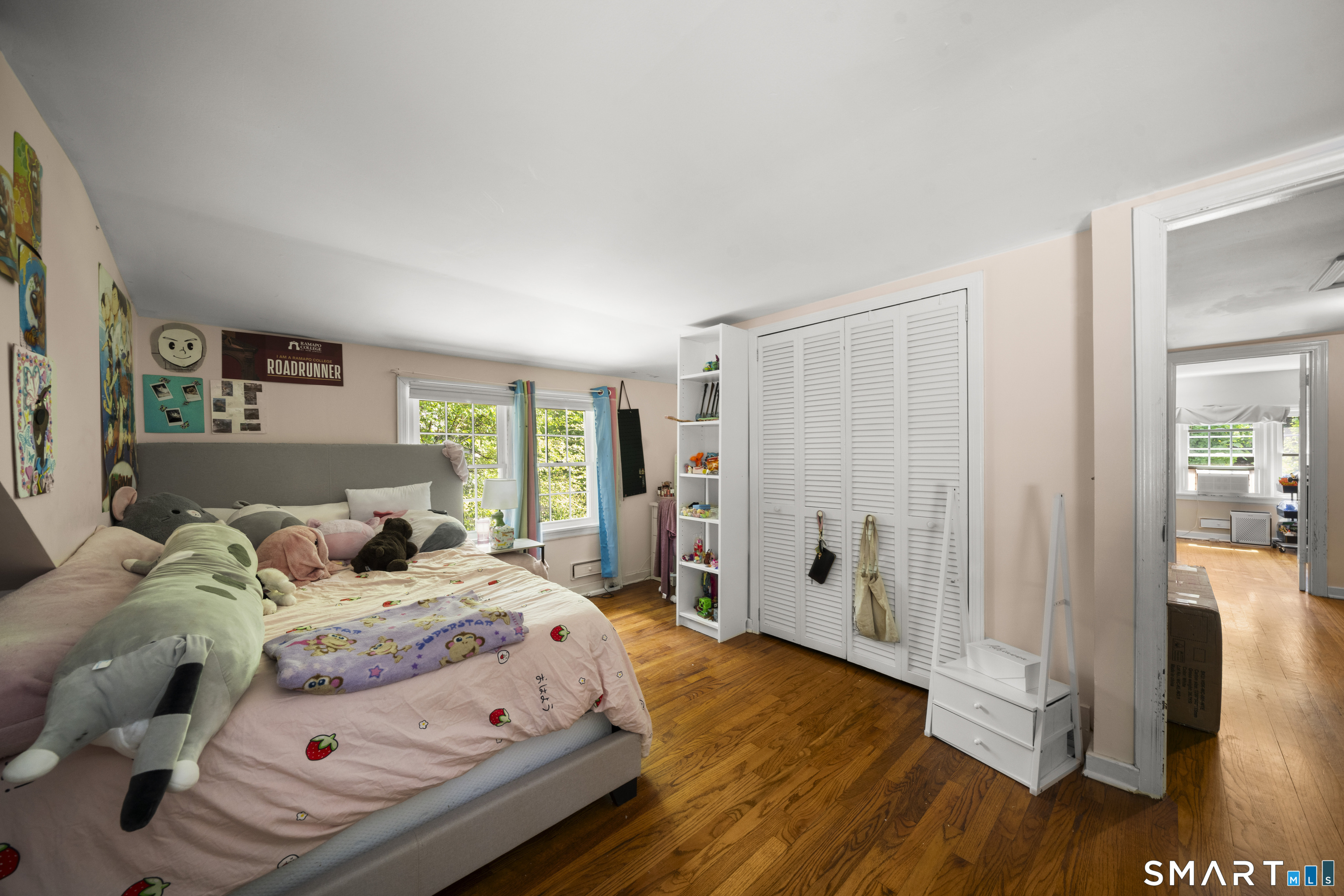 211 Whisconier Road Brookfield, CT 06804 - Photo 24 of 38 a bedroom with a bed and a walk in closet