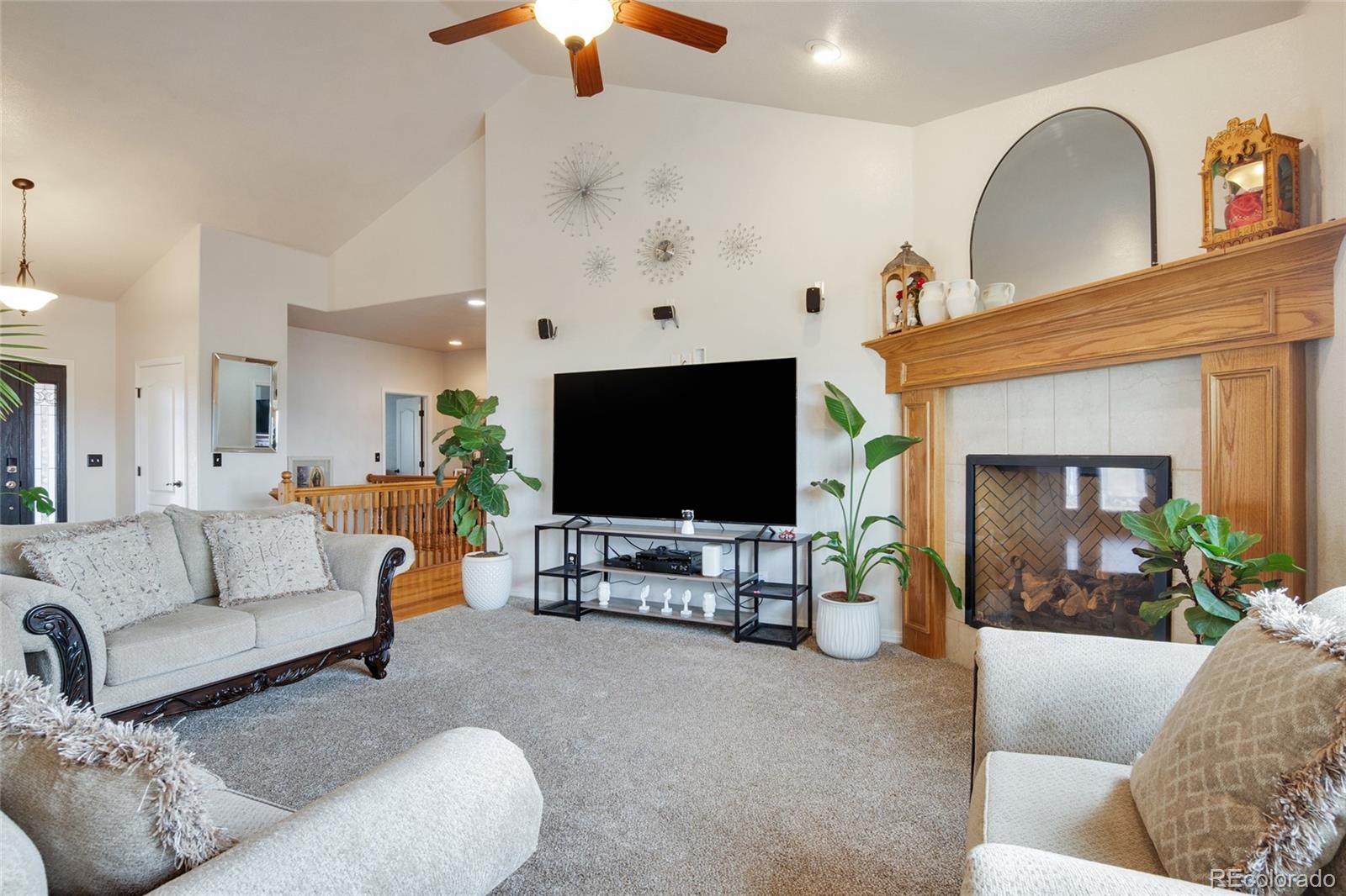 271 Corvette Circle Fort Lupton, CO 80621 - Photo 17 of 39 a living room with furniture and a flat screen tv