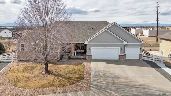 a view of a house with a snow in the yard