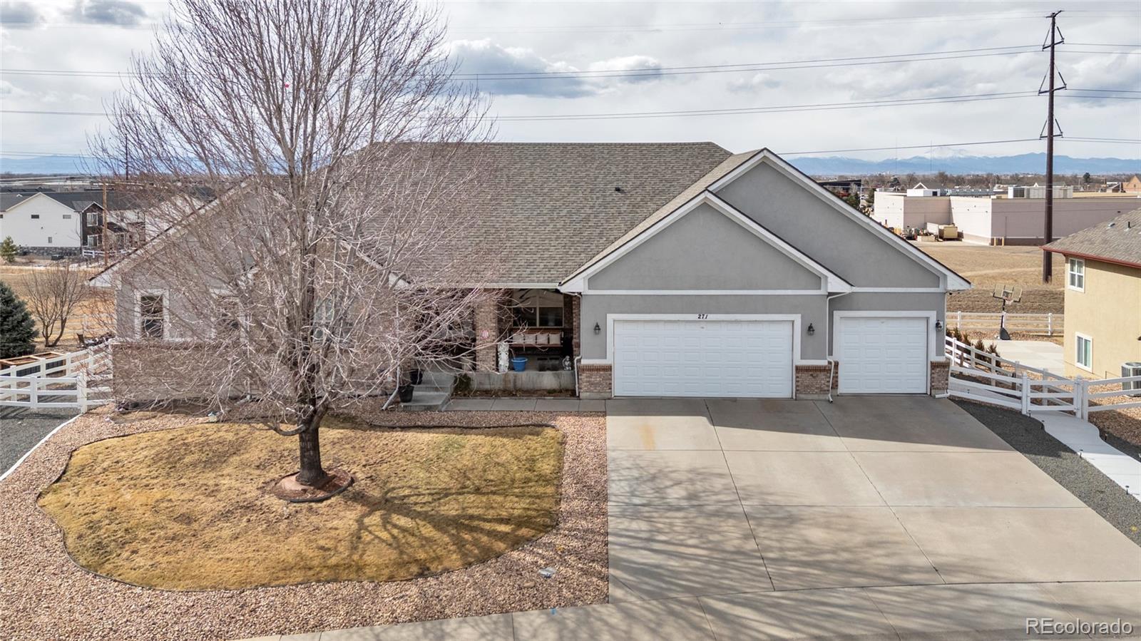 271 Corvette Circle Fort Lupton, CO 80621 - Photo 2 of 39 a view of a house with a snow in the yard