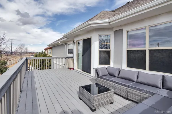 a balcony view with a seating space