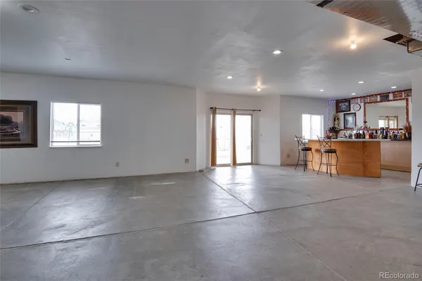 a view of a kitchen with a sink and a window