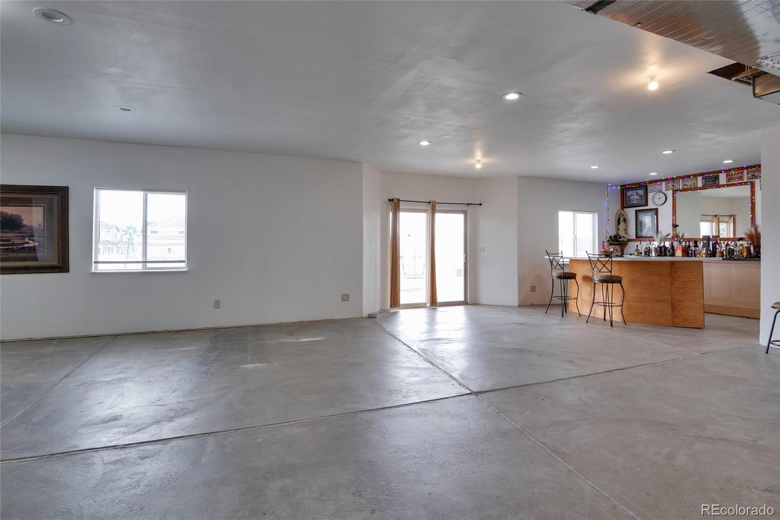 271 Corvette Circle Fort Lupton, CO 80621 - Photo 23 of 39 a view of a kitchen with a sink and a window