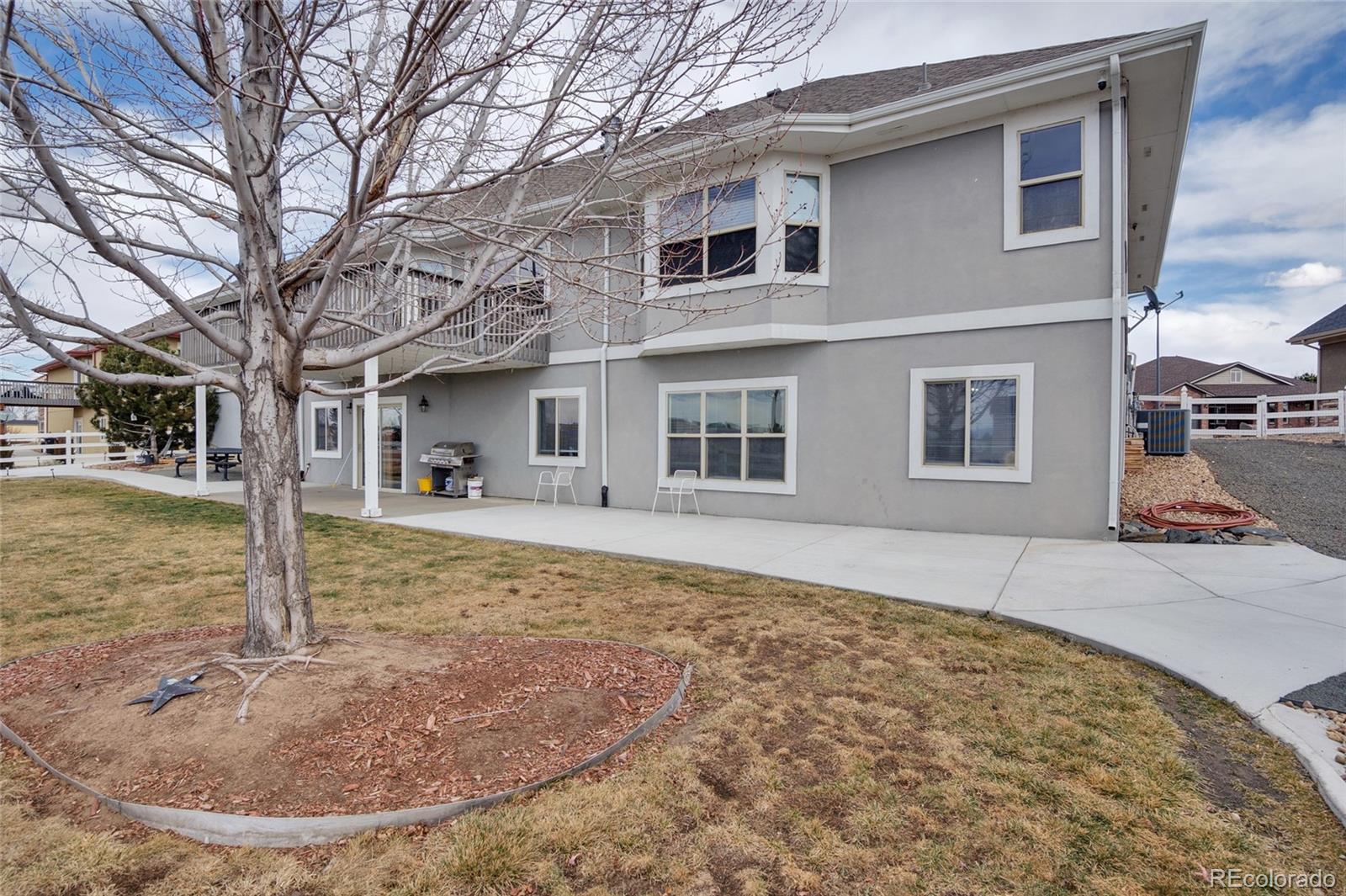 271 Corvette Circle Fort Lupton, CO 80621 - Photo 27 of 39 a view of a house with snow in the background