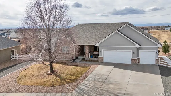 a front view of a house with yard