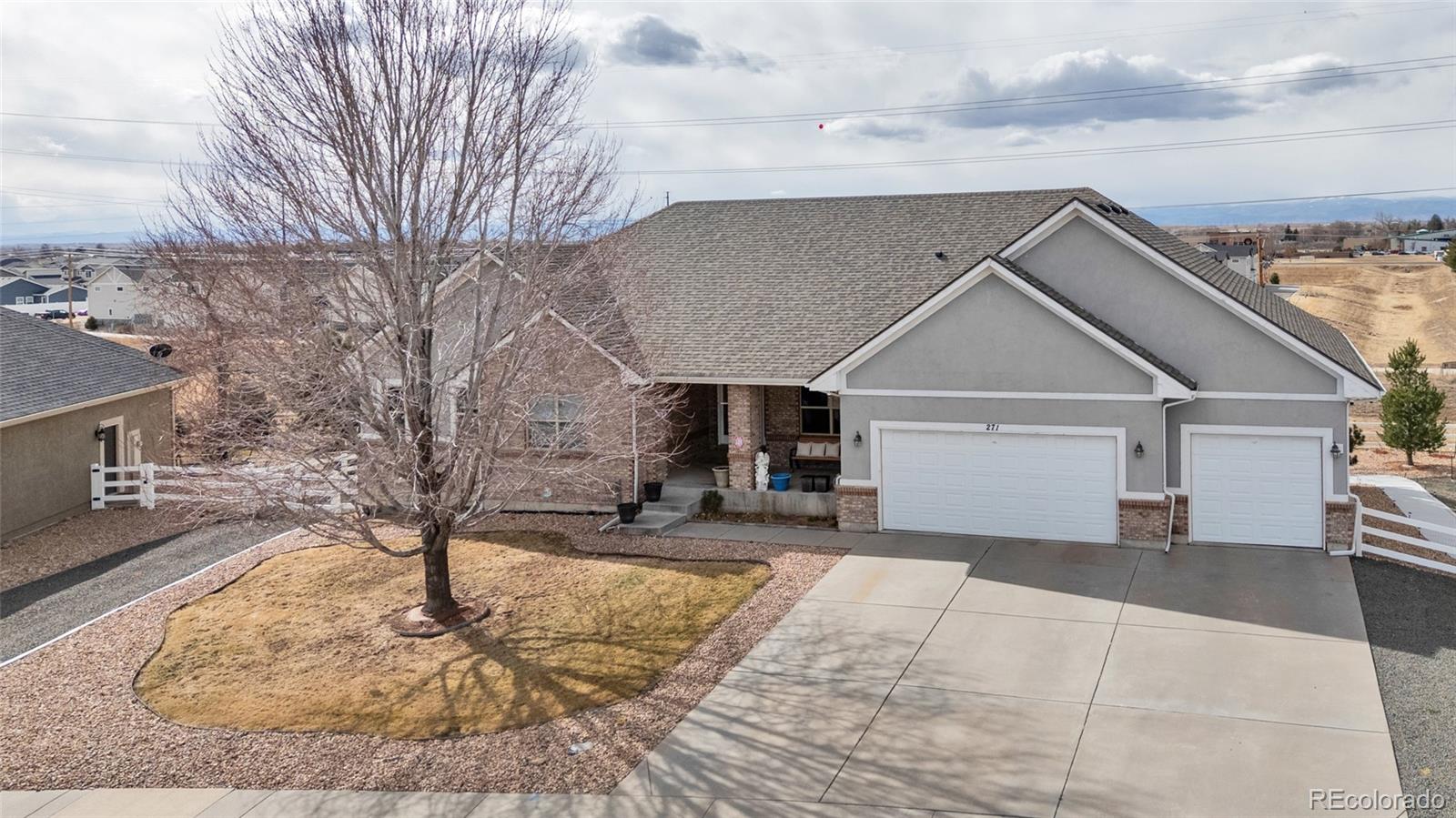 271 Corvette Circle Fort Lupton, CO 80621 - Photo 31 of 39 a front view of a house with yard