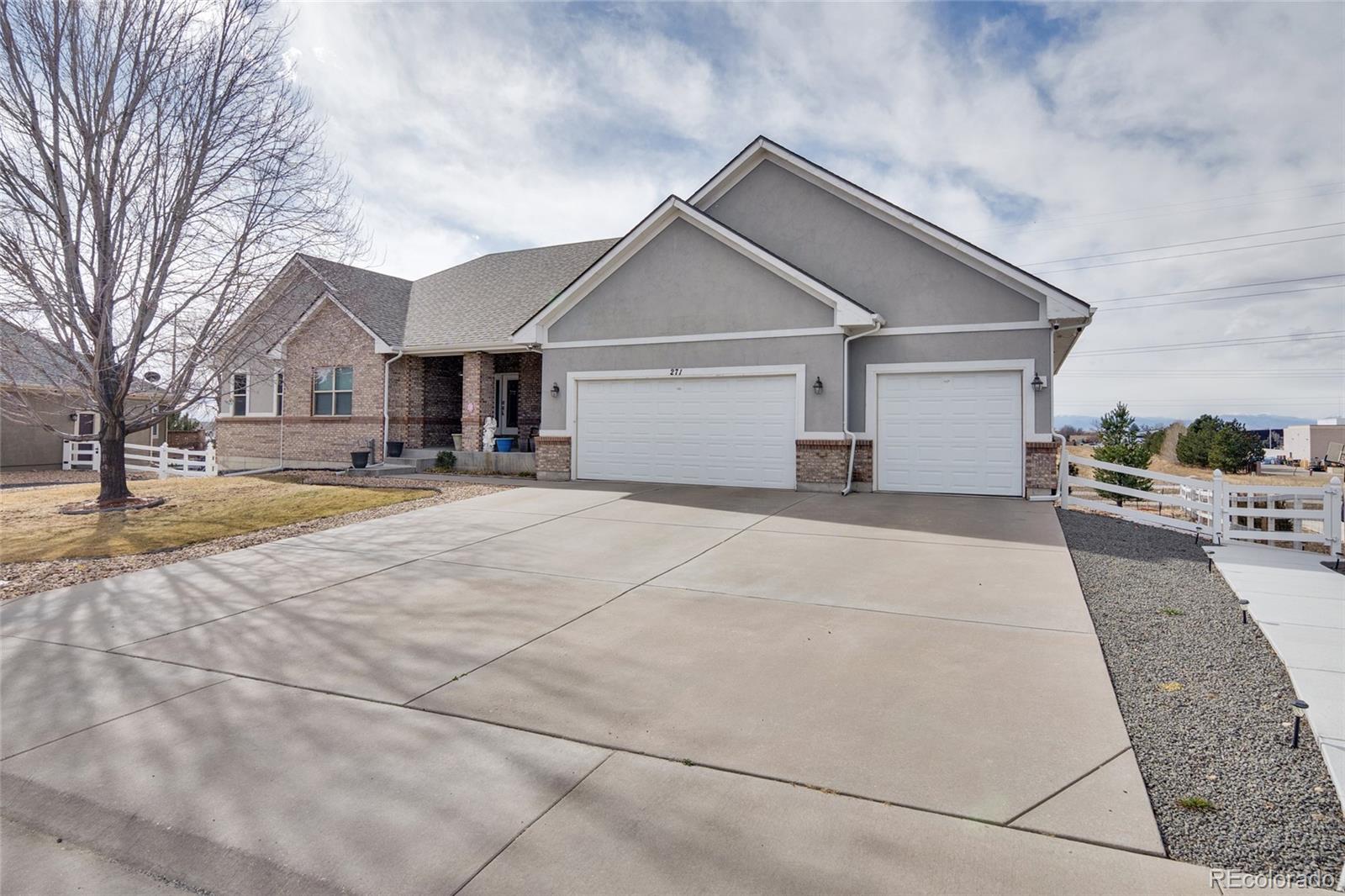 271 Corvette Circle Fort Lupton, CO 80621 - Photo 32 of 39 a view of a house with a yard