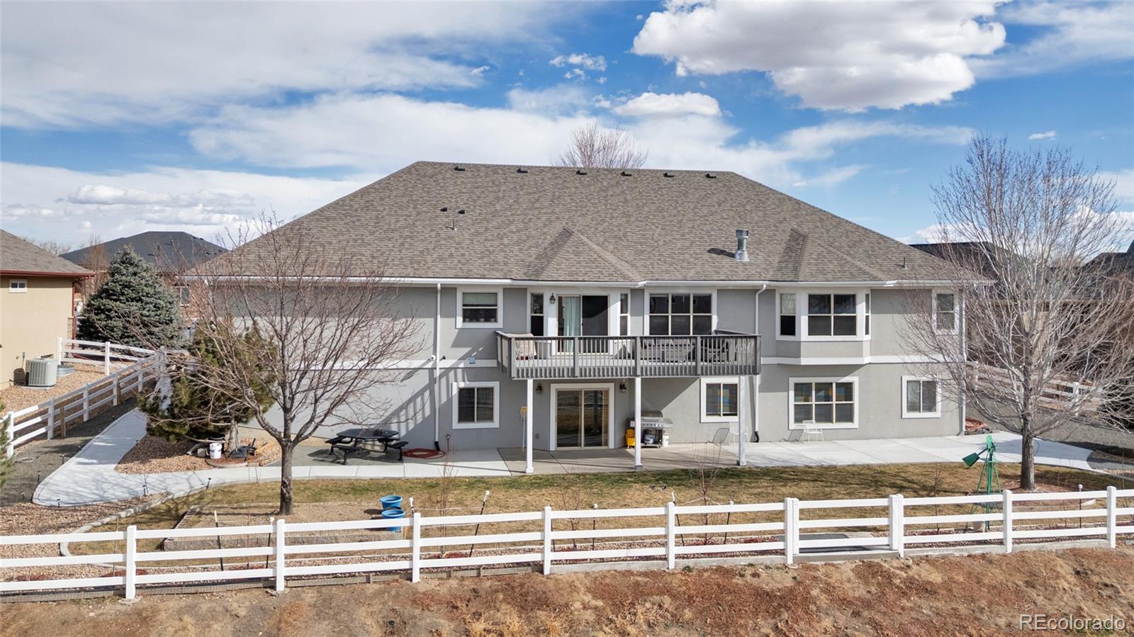 271 Corvette Circle Fort Lupton, CO 80621 - Photo 33 of 39 a front view of a house with a garden