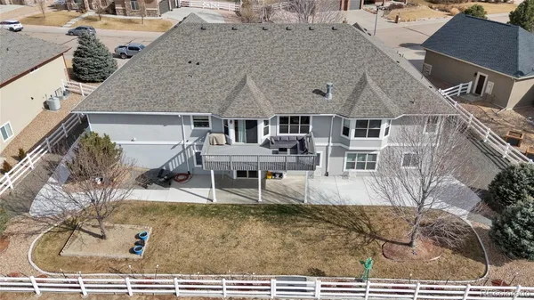 an aerial view of a house with entertaining space