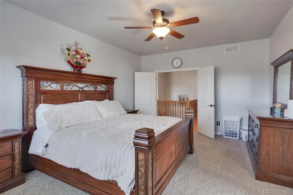 a bed room with a bed and a chandelier
