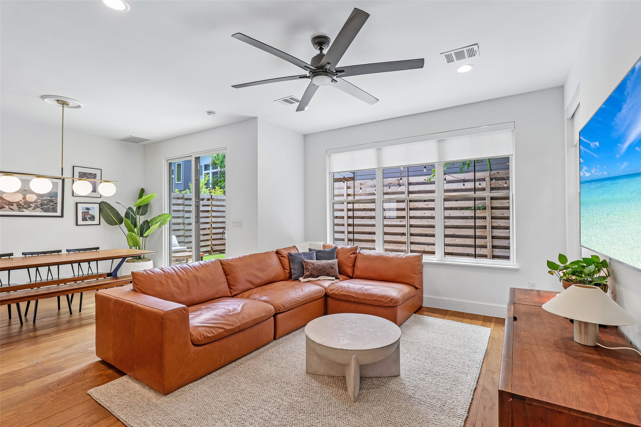 1706 Perez Street, Unit 1 Austin, TX 78721 - Photo 6 of 36 A warm, inviting living area with rich hardwood floors and an abundance of natural light.