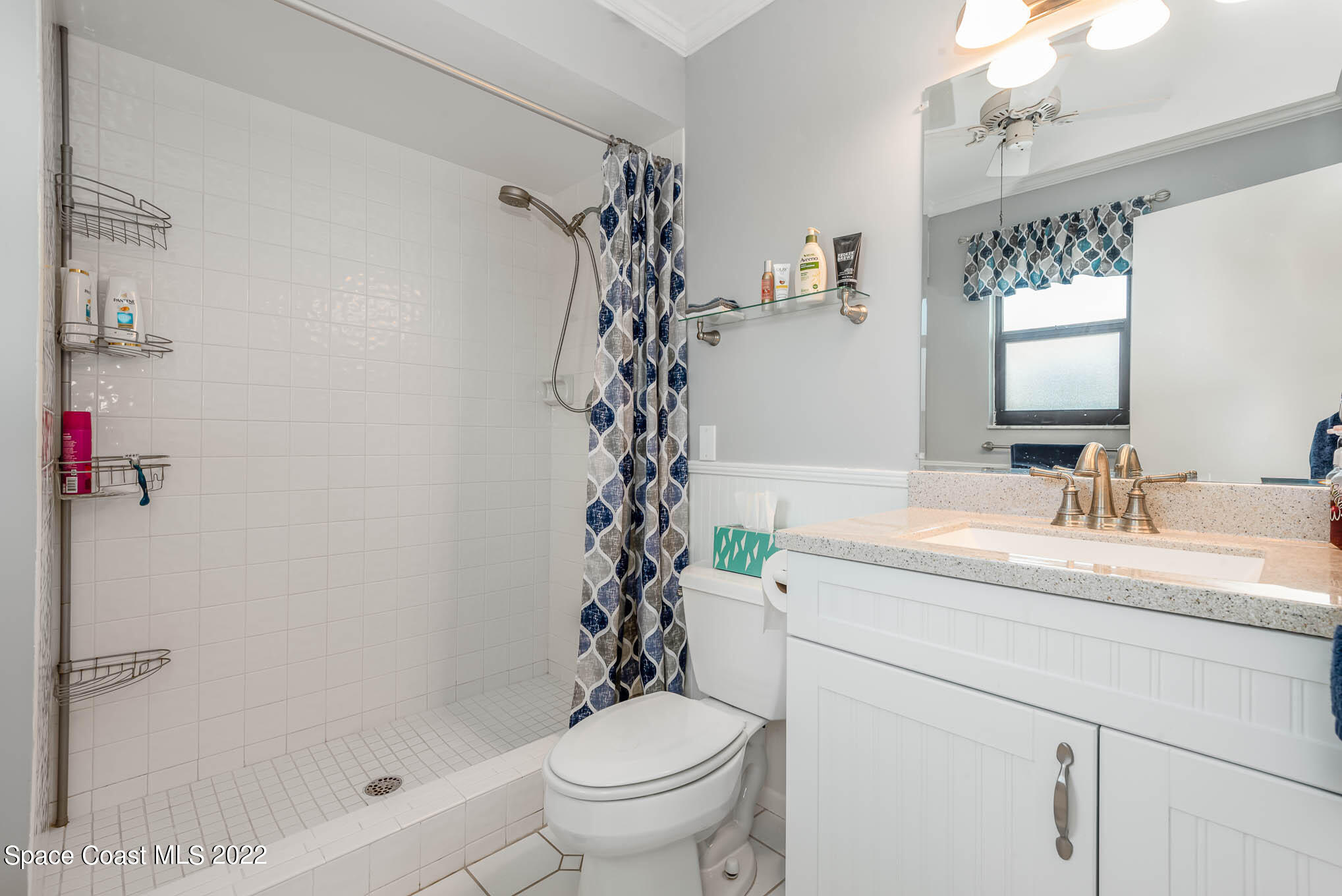 115 Normandy Place Melbourne Beach, FL 32951 - Photo 13 of 31 a bathroom with a sink a toilet and shower