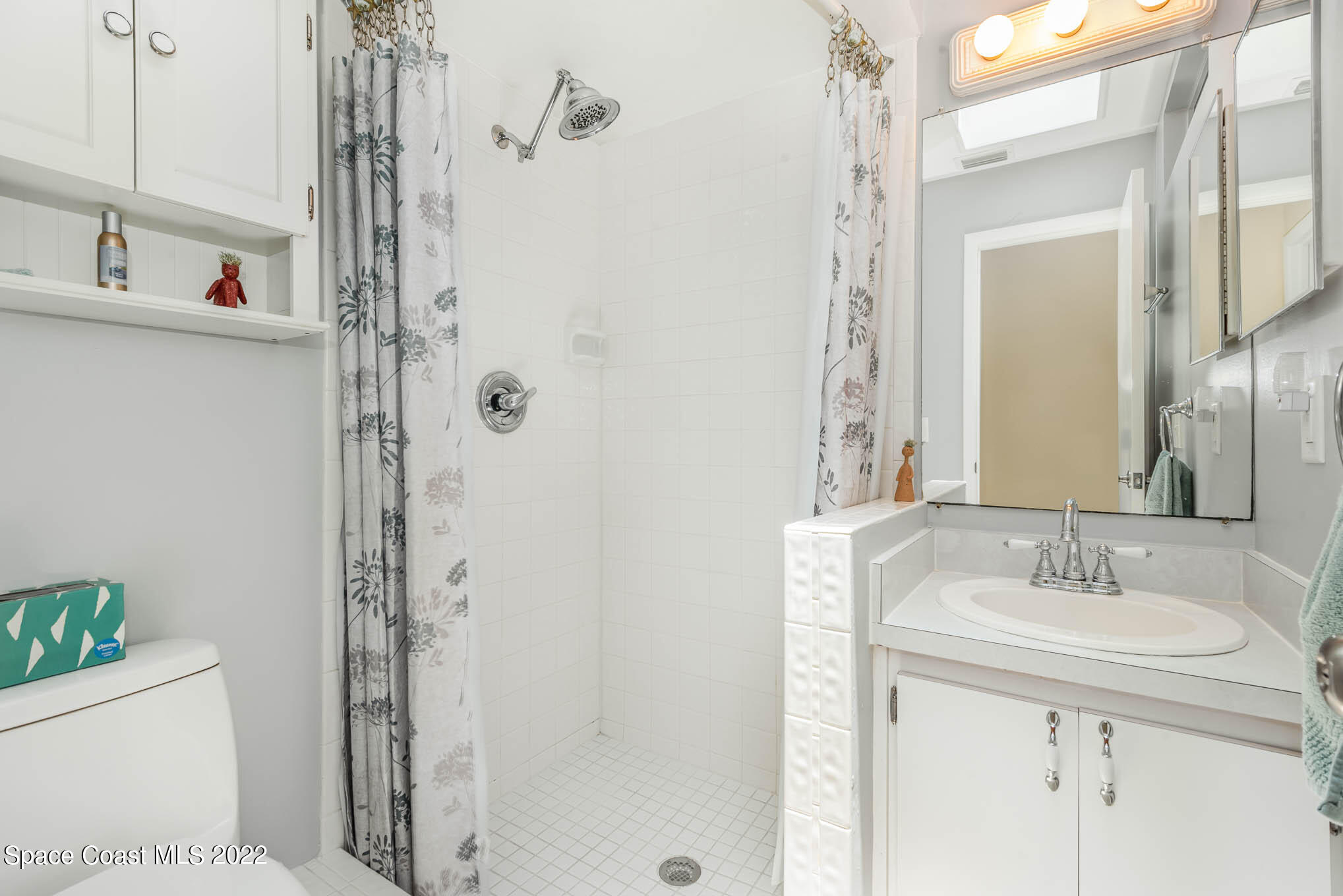 115 Normandy Place Melbourne Beach, FL 32951 - Photo 16 of 31 a bathroom with a sink a toilet and shower