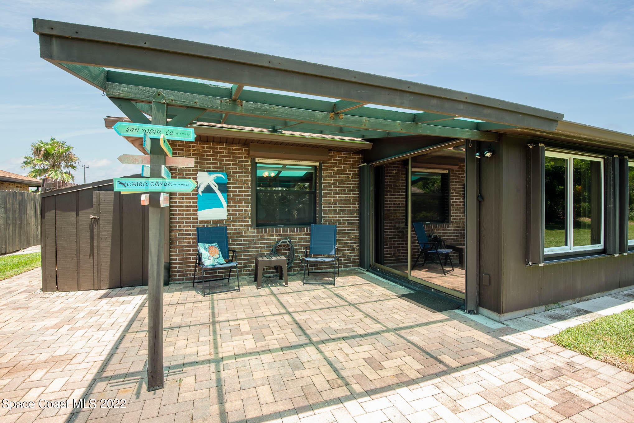 115 Normandy Place Melbourne Beach, FL 32951 - Photo 17 of 31 a view of a house with a patio