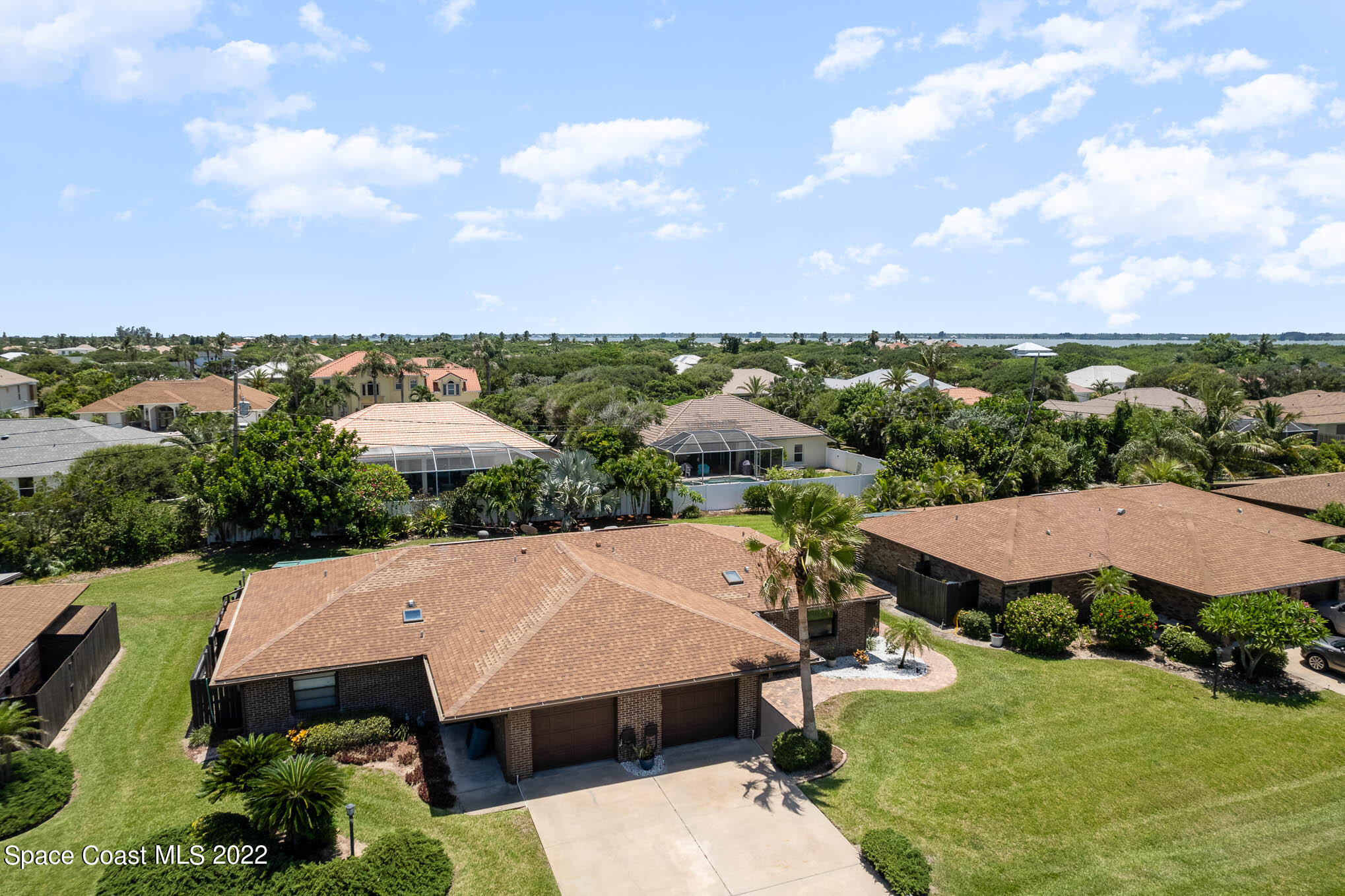 115 Normandy Place Melbourne Beach, FL 32951 - Photo 21 of 31 an aerial view of a house with a garden