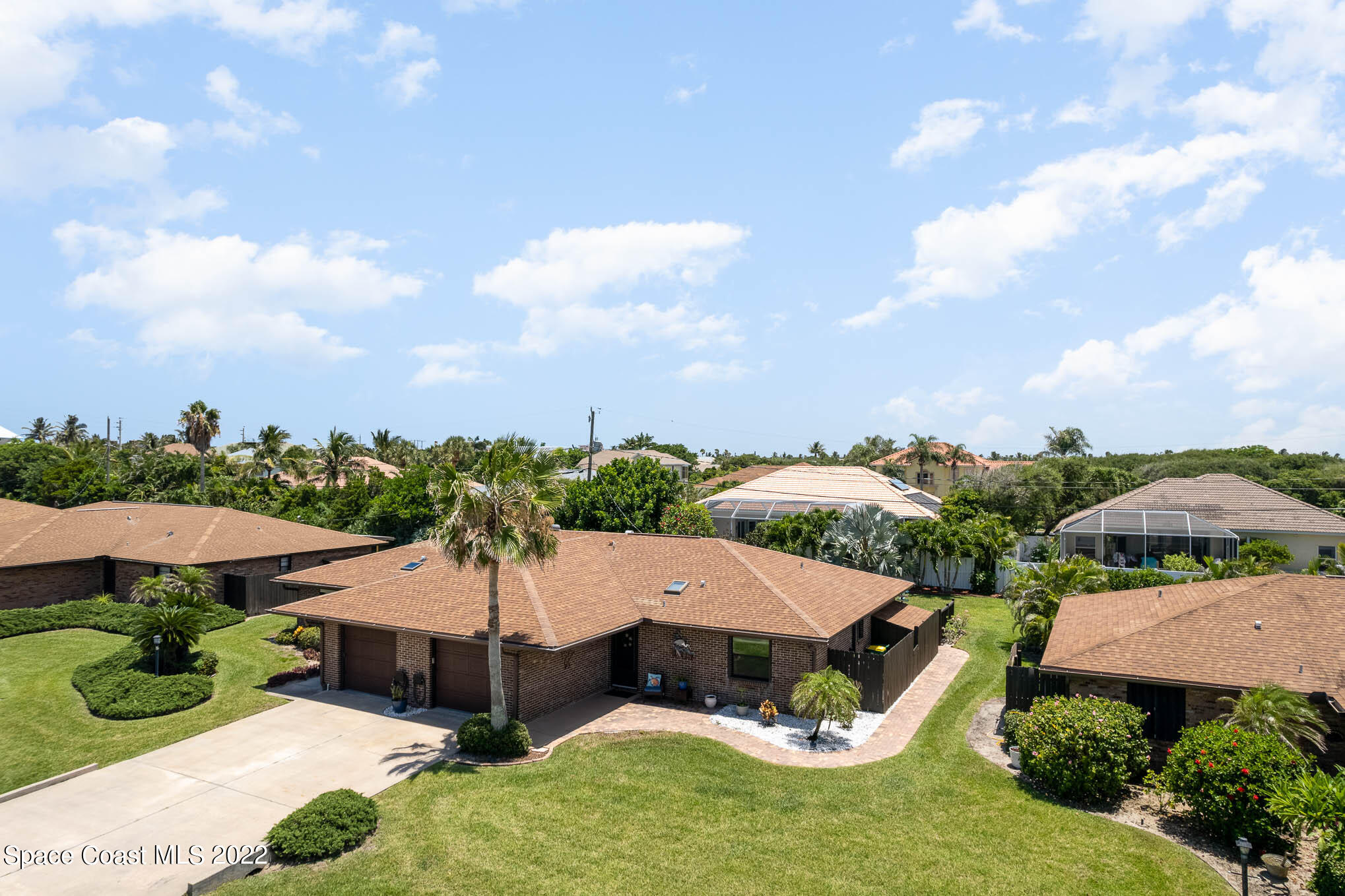 115 Normandy Place Melbourne Beach, FL 32951 - Photo 26 of 31 an aerial view of a house with garden space and street view