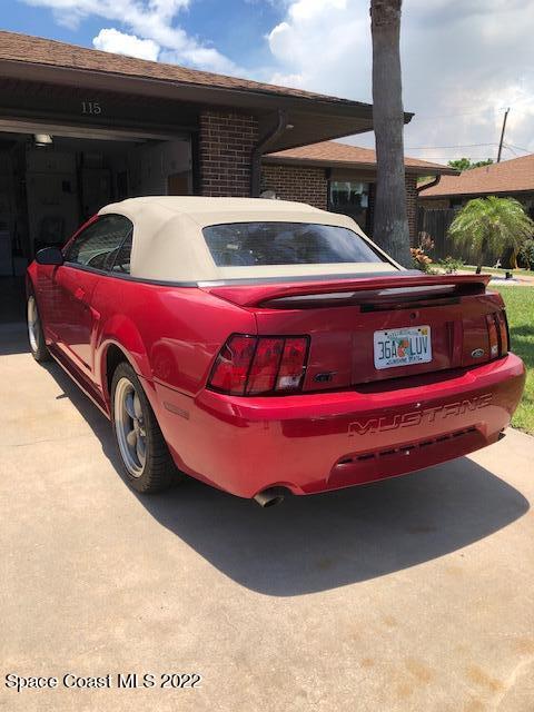 115 Normandy Place Melbourne Beach, FL 32951 - Photo 28 of 31 a view of a red car parked in garage