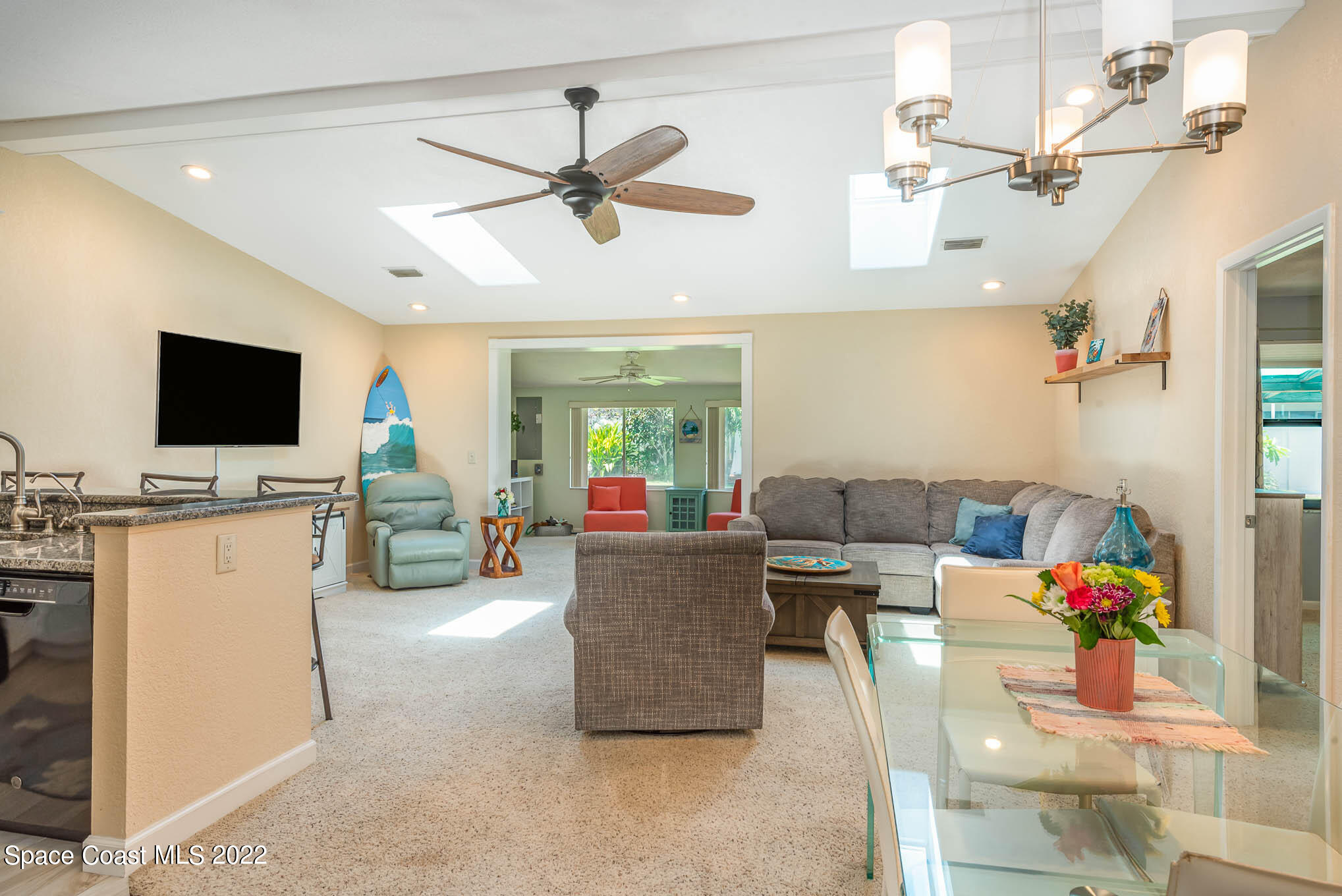 115 Normandy Place Melbourne Beach, FL 32951 - Photo 3 of 31 a living room with furniture and a flat screen tv
