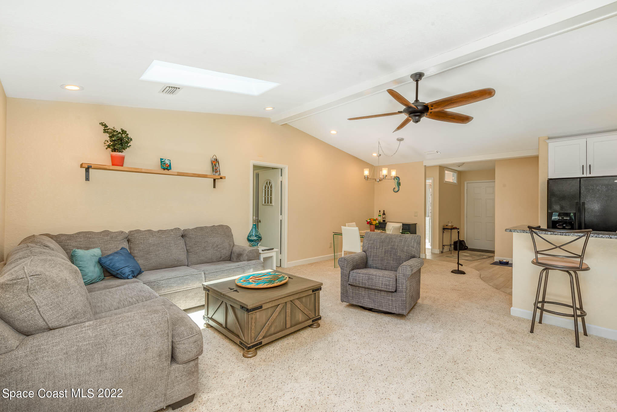 115 Normandy Place Melbourne Beach, FL 32951 - Photo 4 of 31 a living room with furniture and a flat screen tv