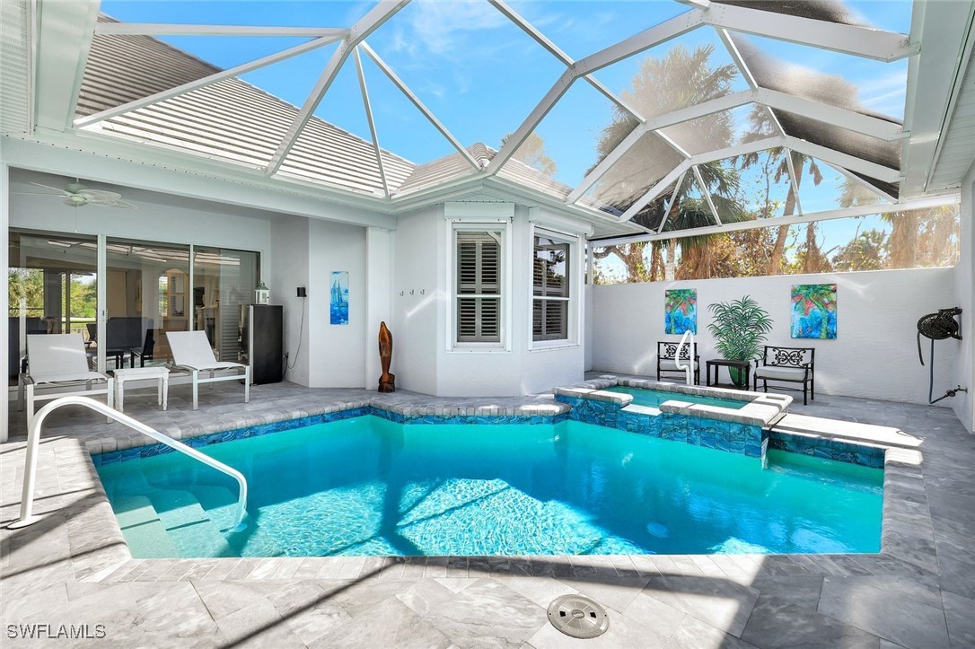 2450 Wulfert Road Sanibel, FL 33957 - Photo 5 of 44 a view of a house with a backyard porch and sitting area
