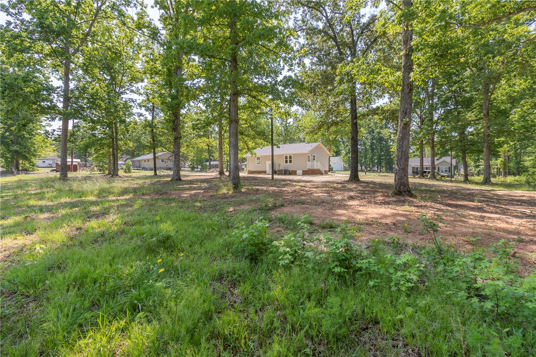 113 Linda Lane Honea Path, SC 29654 - Photo 36 of 36 This tranquil lot offers a serene setting with ample greenery, perfect for a peaceful retreat.