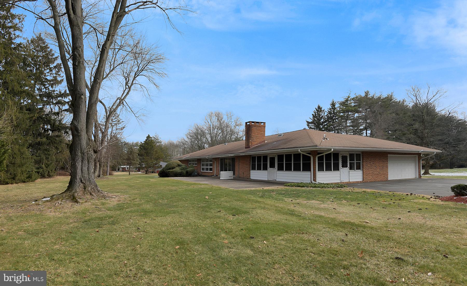 28 West Church Road Lawrence Township, NJ 08648 - Photo 3 of 32 a view of a white house with a large tree and a yard
