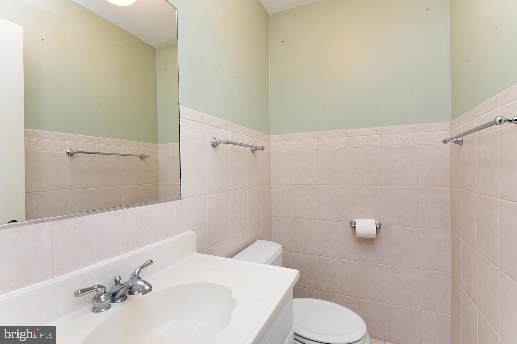 28 West Church Road Lawrence Township, NJ 08648 - Photo 31 of 32 a bathroom with a sink and a toilet