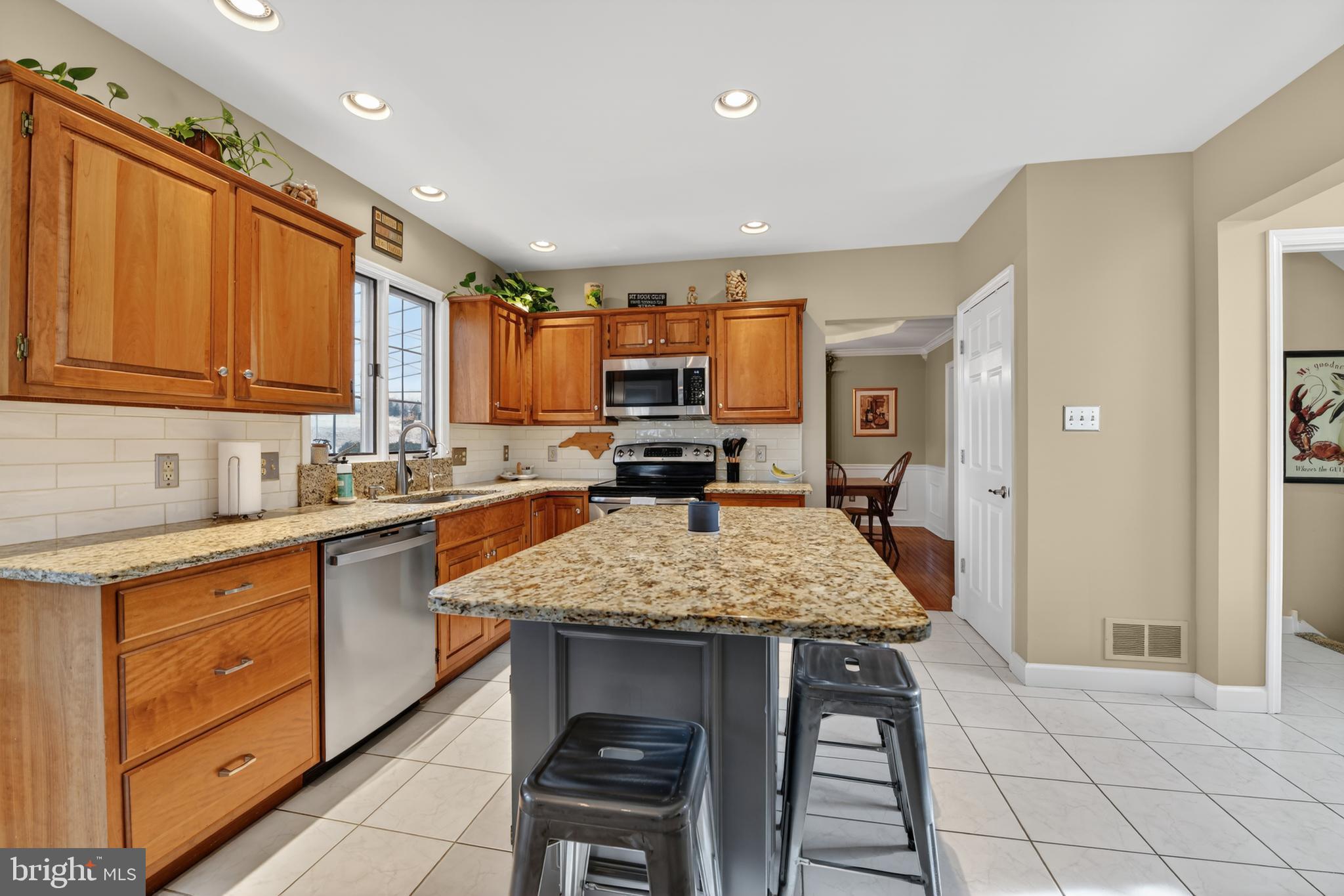 110 Pennsylvania Avenue Sinking Spring, PA 19608 - Photo 14 of 53 a kitchen with a sink stove and refrigerator