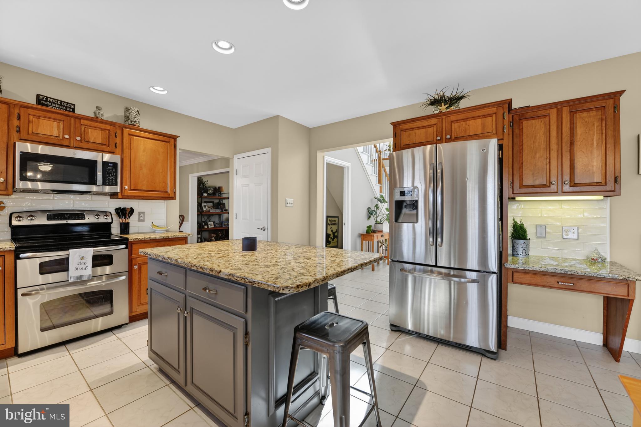 110 Pennsylvania Avenue Sinking Spring, PA 19608 - Photo 15 of 53 a kitchen with stainless steel appliances granite countertop a refrigerator oven a stove top oven and a refrigerator