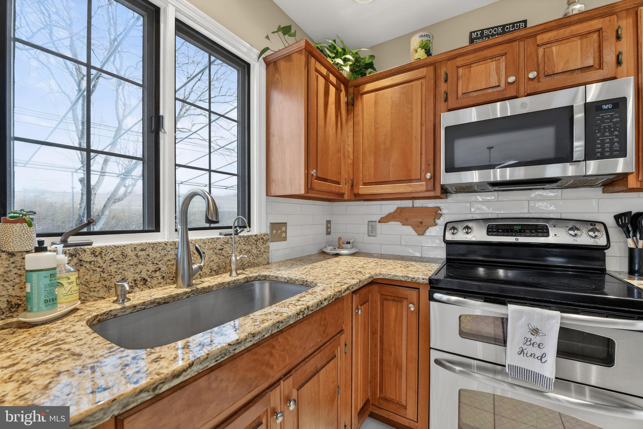 110 Pennsylvania Avenue Sinking Spring, PA 19608 - Photo 16 of 53 a kitchen with stainless steel appliances granite countertop a sink stove and microwave