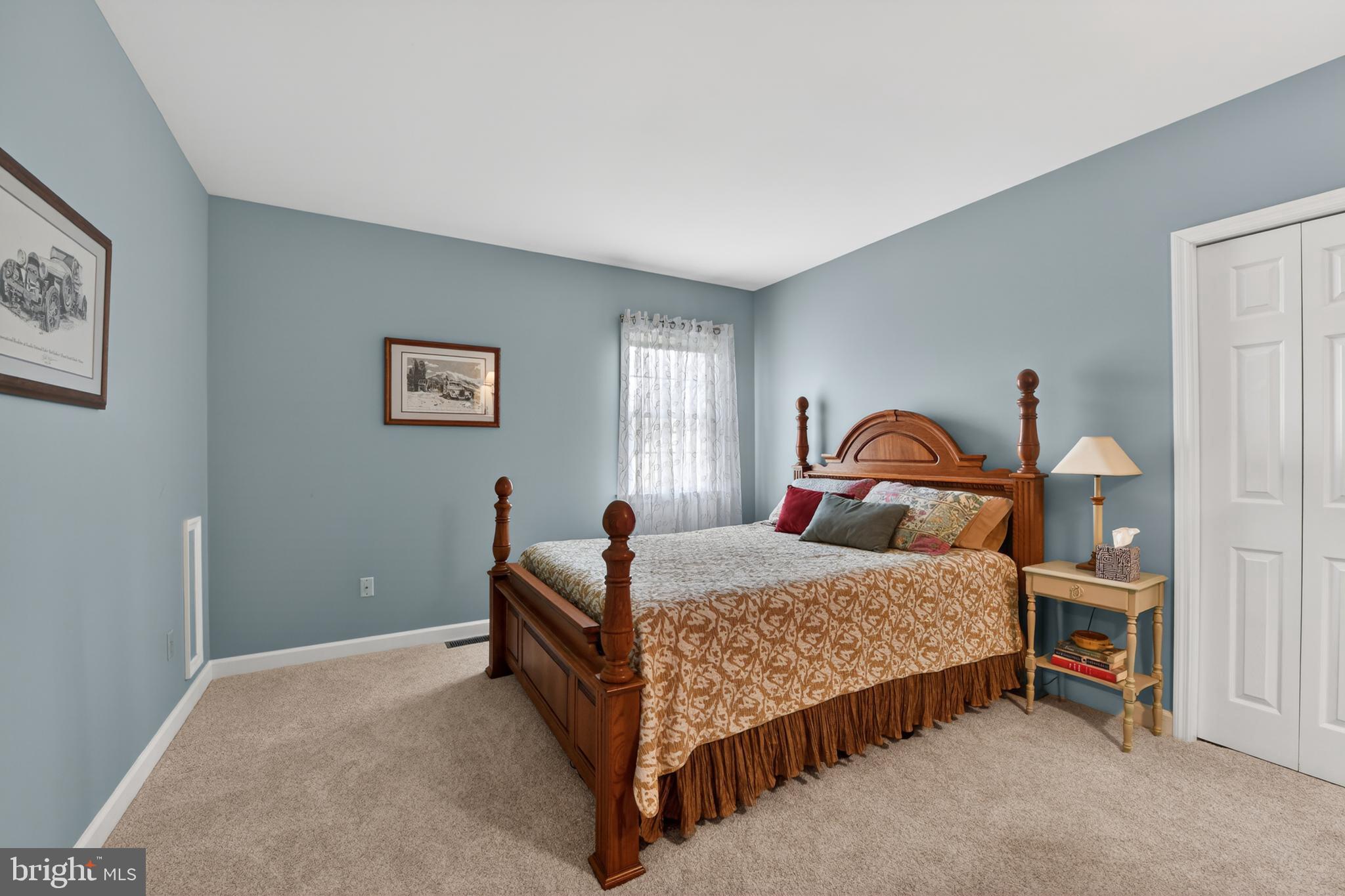 110 Pennsylvania Avenue Sinking Spring, PA 19608 - Photo 26 of 53 a bedroom with a bed and a lamp on table