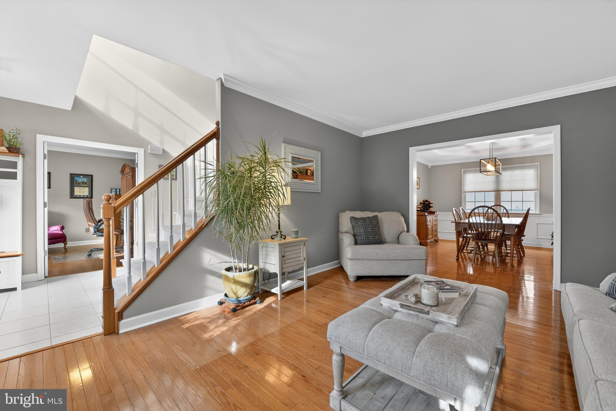 110 Pennsylvania Avenue Sinking Spring, PA 19608 - Photo 8 of 53 a living room with furniture and a dining table with wooden floor