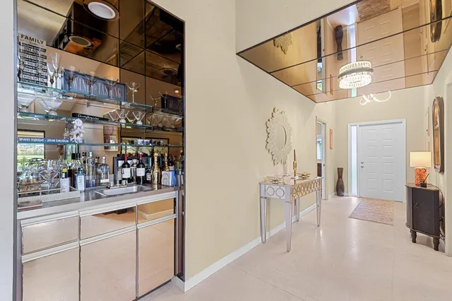 a living room with furniture large window and a flat screen tv