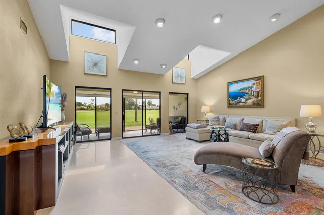 a living room with furniture and a table