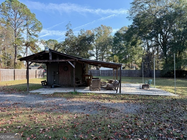 822 North Lewis Street Metter, GA 30439 - Photo 18 of 19 a view of a house with backyard